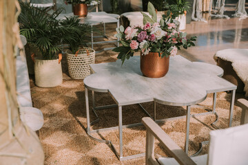 wooden tables and chairs with colorful flowers