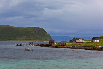 Fototapeta na wymiar Fishing village on the Barents sea shore on the way between Olderfjord and the North Cape in northern Norway
