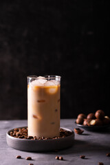 A glass of iced coffee on a table, copy space for text