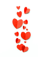 Valentine's Day background. Red paper hearts on a white background. Bright colorful hearts for postcards. - 404883301