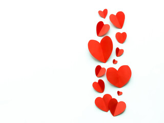 Valentine's Day background. Red paper hearts on a white background. Bright colorful hearts for postcards. - 404883310