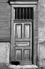 Old wooden house with cat.