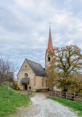Fototapeta na wymiar Church of Saint Ingenuino, Barbiano Village in South Tyrol, northern Italy - Europe - Gothic style church