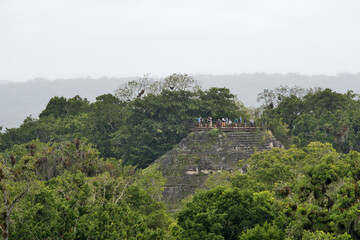 Fototapeta na wymiar Tikal, Guatemala, Central America: Mayan ruins rise above the jungle in the famous Tikal National Park, UNESCO World Heritage.