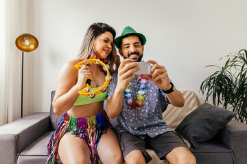 Brazilian Carnival. Couple celebrating carnival at home