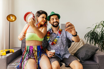 Brazilian Carnival. Couple celebrating carnival at home