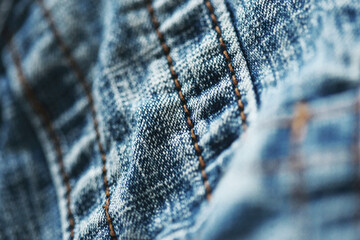 Jeans denim texture close up , focus only one point , soft blured background wallpaper