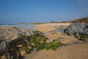 Newquay Fistral beach with rocks and seaweed North Cornwall south west UK