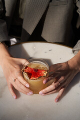 Bee gross cocktail with pineapple slice and whipped cream