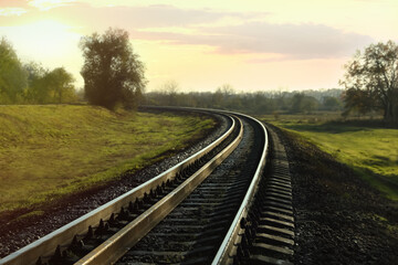 Fototapeta na wymiar Railway line in countryside on sunny day. Train journey