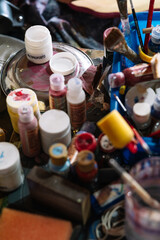 paints and brushes used for crafts