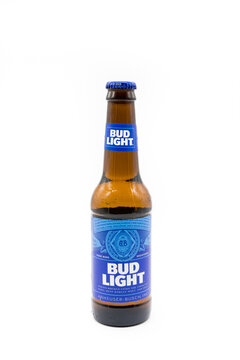 Budweiser branded bottle of Bud Light Beer in a recyclable glass bottle and on a white background.