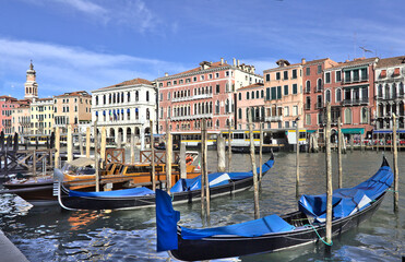 Fototapeta na wymiar Gondolas in a canal in Venice, Italy