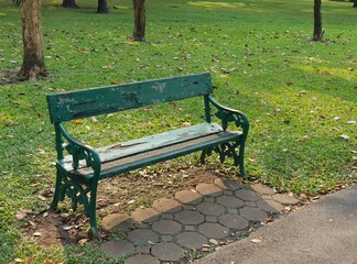 Green chair in the park.