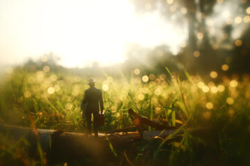 Surreal image of mysterious man walking alone during sunset