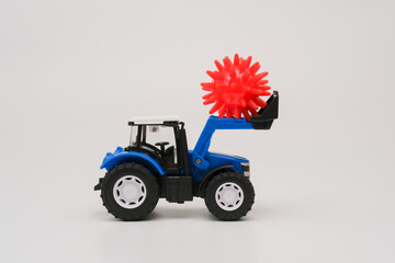 Blue tractor with red virus form. Virus pandemic protection and fighting concept