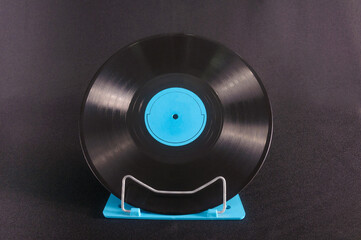 Vinyl record with music on a stand