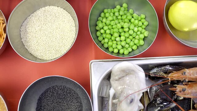 An aerial take of a table with some vegetables and ingredients