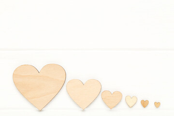 Brown hearts on white wooden table