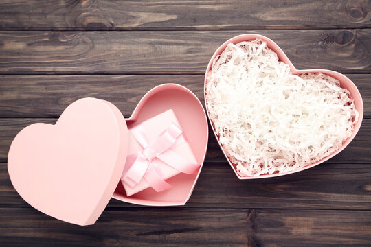 Heart Shaped Gift Box On Brown Wooden Table