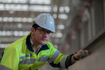 Obraz premium engineer Sitting in depot and inspection railway . construction worker on railways. Engineer work on railway. rail, engineer, Infrastructure