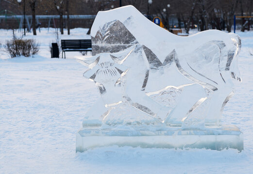 Kazakhstan, Almaty - January 04, 2021: The ice bull. Ice sculpture of a bull in the park for the new year, of the symbol of the year 2021. Editorial. 