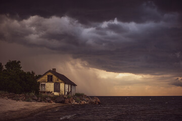 Old house by the sea in overcast