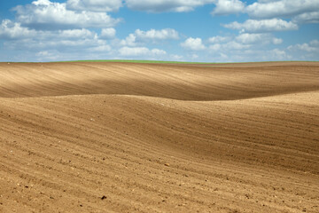 Fototapeta na wymiar Plowed field landscape agriculture spring season
