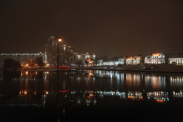 Fototapeta na wymiar Panoramic view of Svisloch river with Trinity suburb in the evening in winter. Minsk. Belarus. 