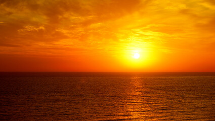 Fototapeta na wymiar Fantastic ocean and sunset sky in red colors.