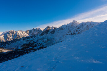 Fototapeta na wymiar Peaks of Tatra Mountains in winter seen from Kasprowy Wierch