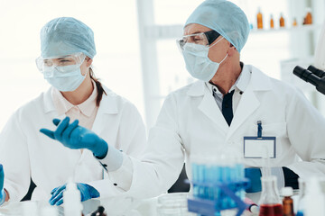 scientists discussing the results of research in a modern laboratory.