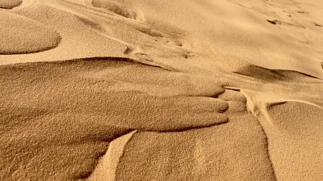 Slow view of desert sand drifting in North Africa Bechar Algeria, sandy Taghit desert