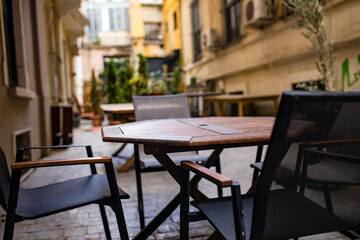 Fototapeta na wymiar Empty tables and chairs , nobody tourist in the street curfew tourism