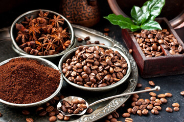 Coffee beans and ground powder on dark  background