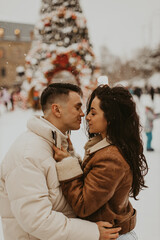 Young Beautiful Couple In Love  kissing and laughing. Amazing winter holiday. Saint Valentine's Day.