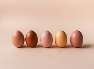Set of Easter eggs varios colored on beige background