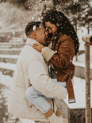 Beautiful Couple In Love kissing and laughing. Amazing winter holiday. Saint Valentine's Day.