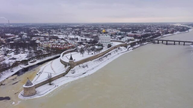 Pskov City and Kremlin in Winter. Russia. Aerial View. Drone Flies Forward, Tilt Up
