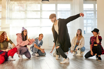 Fototapeta premium male dance enjoy hip-hop or break dance, performing dance, training before concert in modern stylish wear