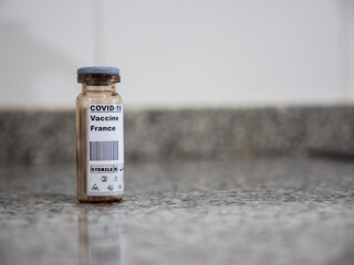 Covid-19 vaccine over a counter with France label
