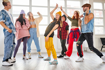 positive youth training hip hop in dance studio, dance classes for young caucasian teens....
