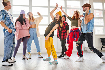 positive youth training hip hop in dance studio, dance classes for young caucasian teens. choreography concept