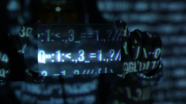 Man with futuristic tablet in hand. Internet, crime, cyber attack, system breaking concept. Blue neon light background. Hacker using an abstract smartphone with a binary code digital interface.