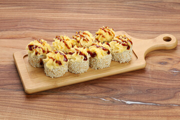 sushi on a wooden board