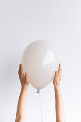 Fototapeta na wymiar Latex balloon, Belbal (440), color Warm Grey pastel, size B95 11 inch, plastic ribbon