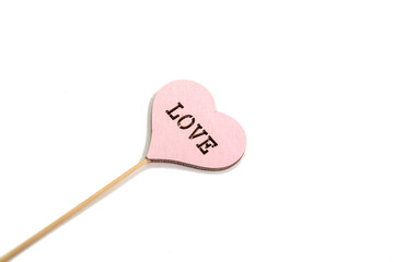 Rustic wooden Valentine red heart on white background. Love in wood, valentine day concept.