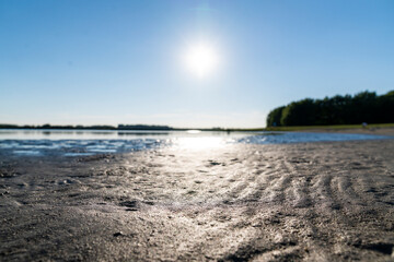 Fototapeta na wymiar Beach with a reflection from the sun