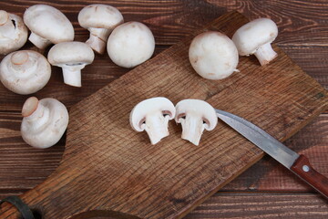 fresh champignons close-up on a wooden table Vegetarian food. Proper nutrition