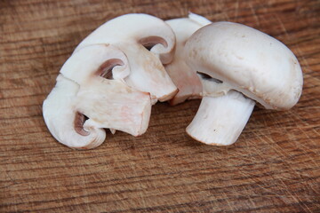 fresh champignons close-up on a wooden table Vegetarian food. Proper nutrition